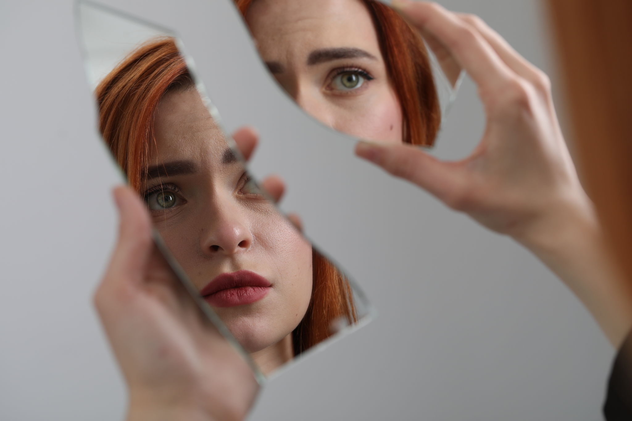A young woman wonders how to put her reflection back together.