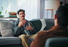 A man with psychologist in office for advice, help or life coaching session. Mental health, consulting and therapist with male patient for emotional support, wellness or talking.