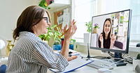 A therapist conducting a telehealth session with a client.