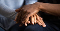 Human hands stacked in care