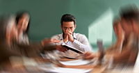 Stress, migraine and motion blur with a business man in a meeting feeling frustrated